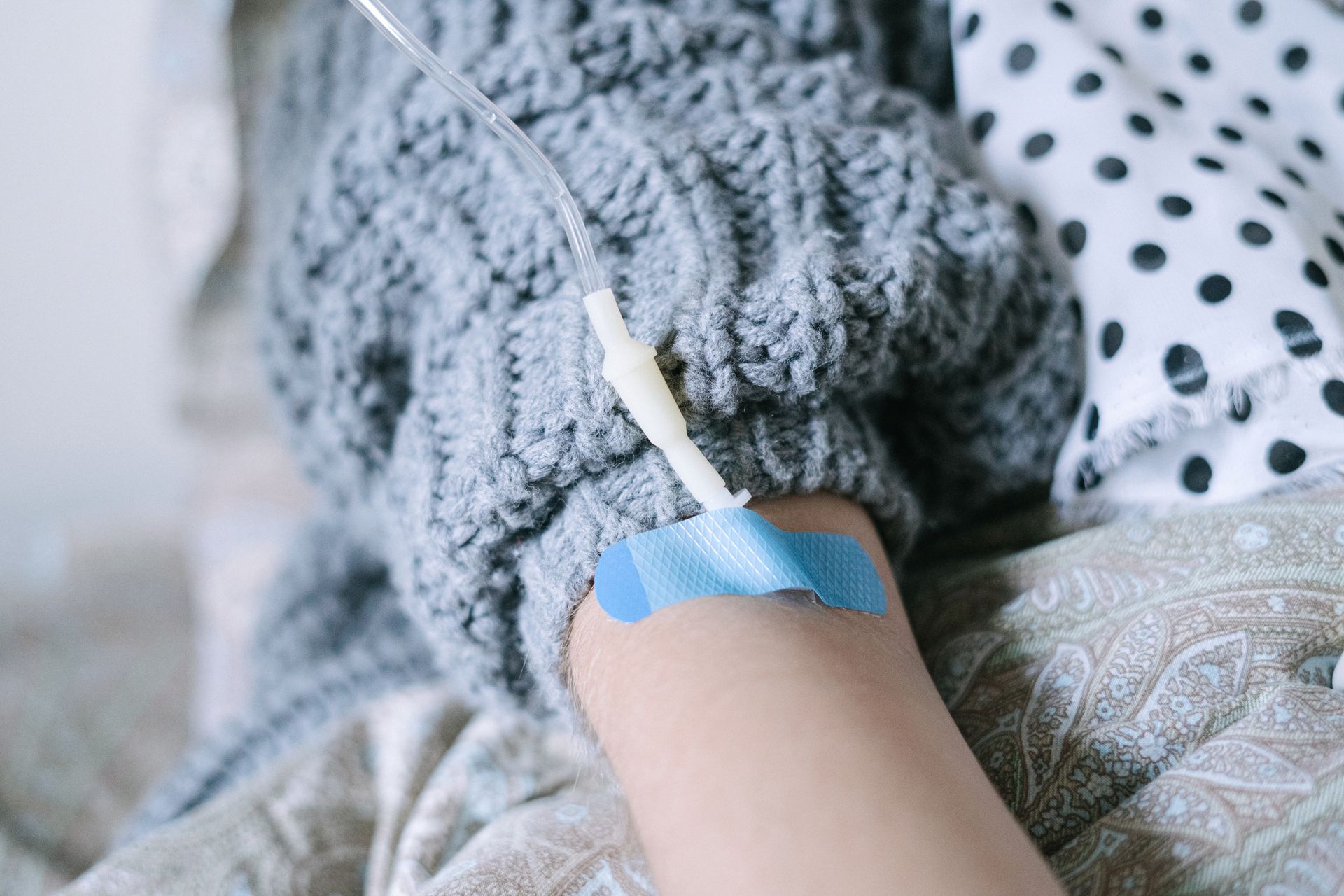 Patient receiving chemotherapy treatment through an IV line