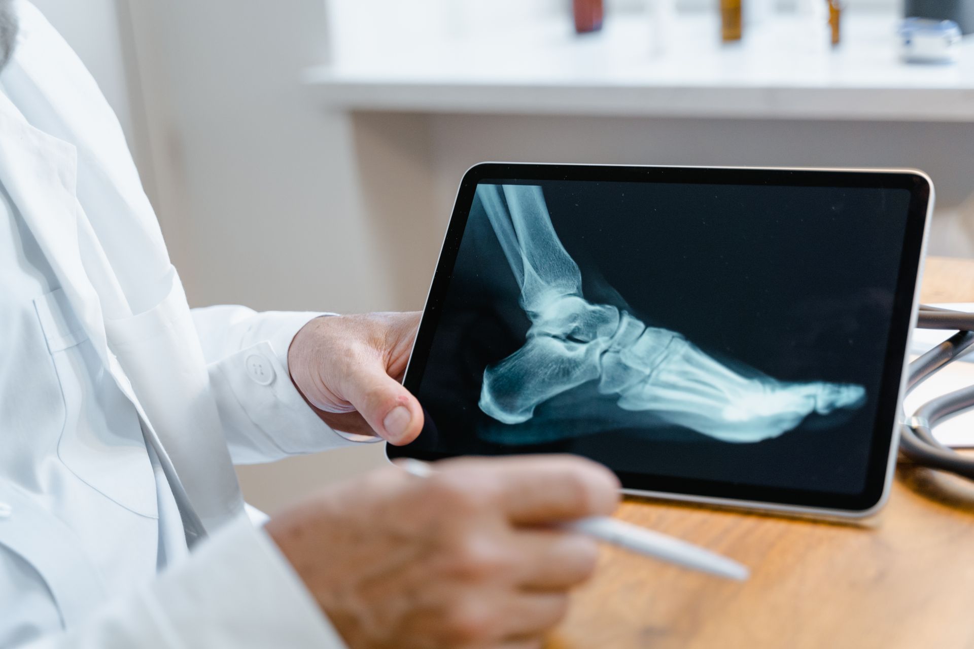 Doctor examining a foot with circulation-related warning signs