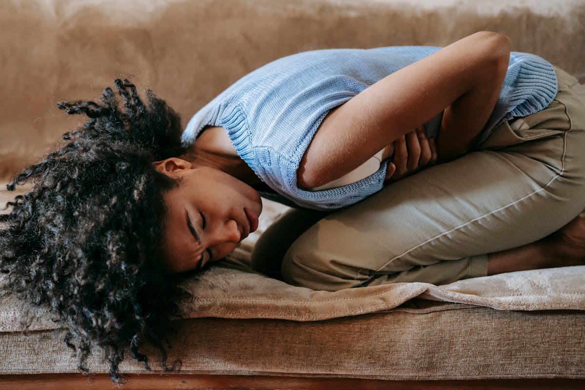 Person experiencing nausea connected to chronic pain