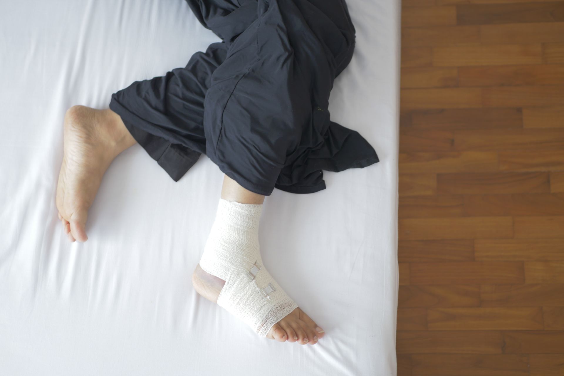 Person holding foot due to pain related to poor circulation from smoking