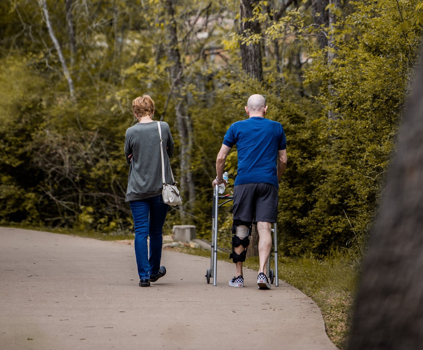 Person using a walking aid because pain affects walking